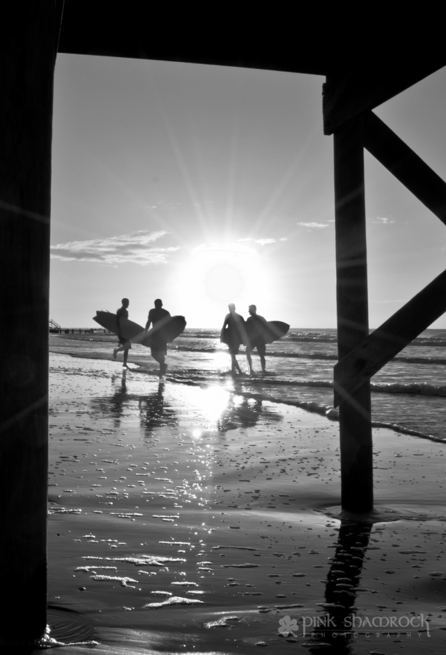 "Sol Surfers" - Surfers silhouetted by the sunrise on Folly Beach, SC.